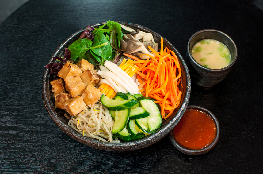 Korean Vegetarian Bibimbap, fried tofu bento box hot stone bowl with salads, kimchi, Bibimbap sauce, miso soup